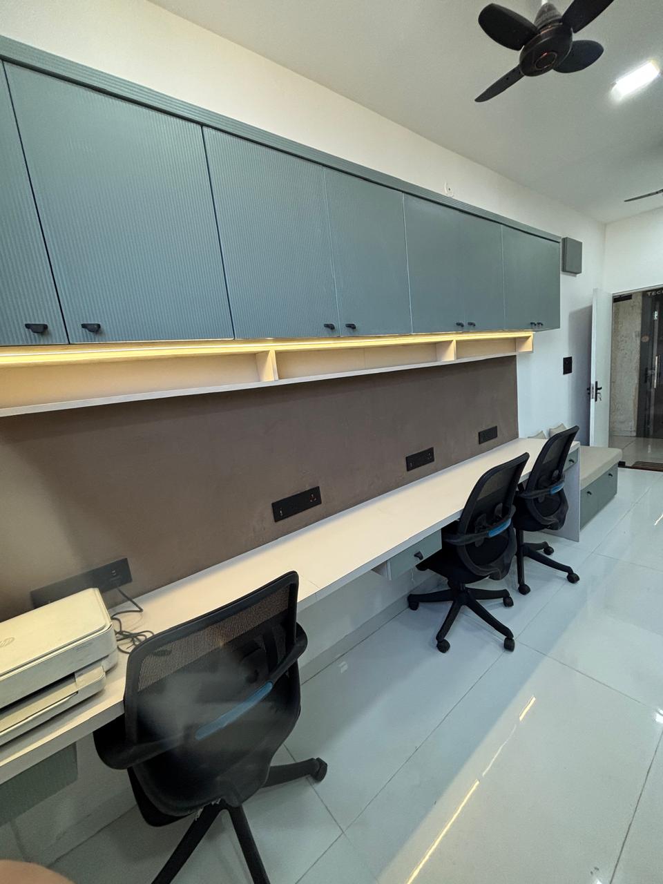 Work desks and cabinetry at H Jain And Company